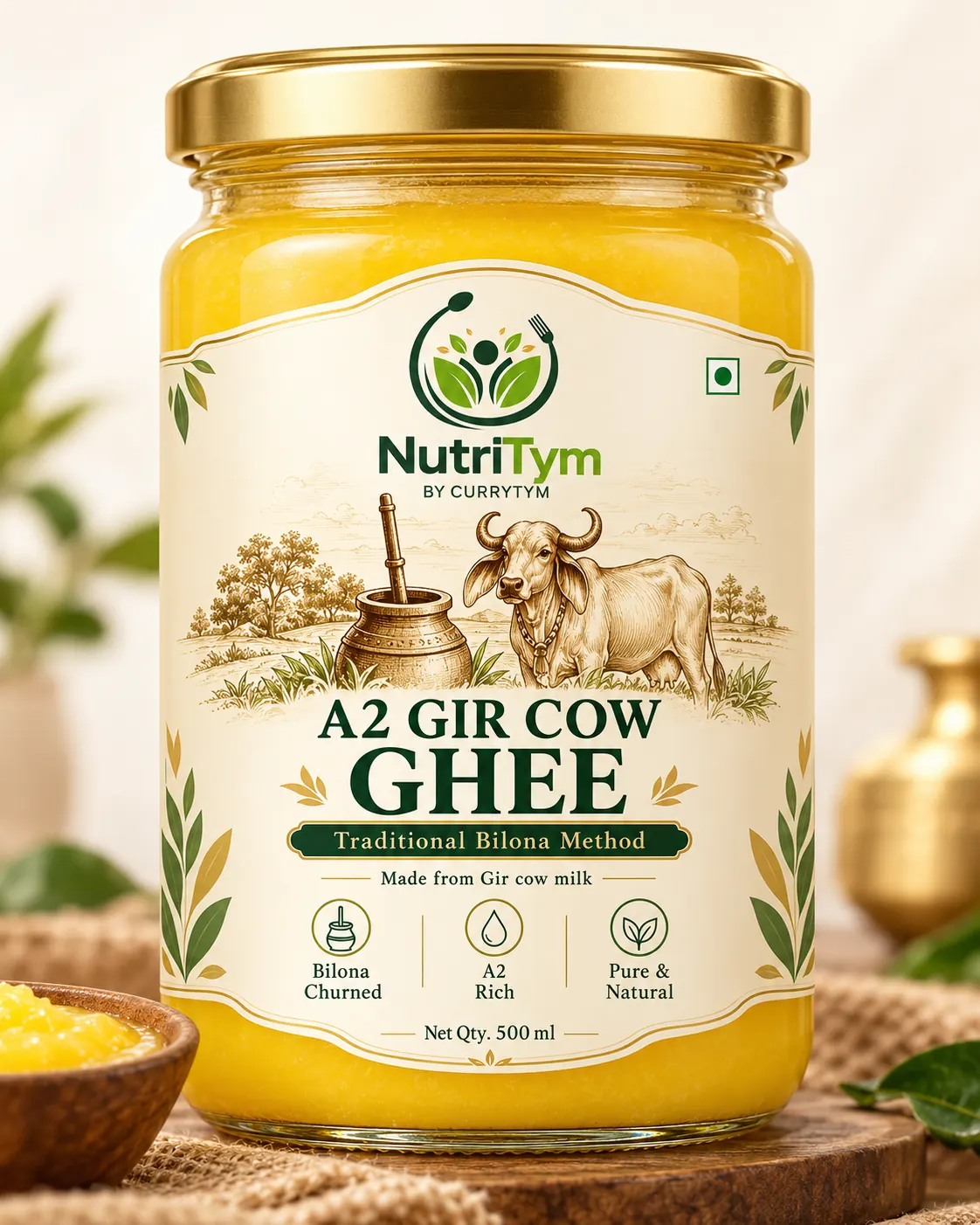 A 500 ml jar of NutriTym A2 Gir Cow Ghee, bilona method, on a wooden board with a brass pot behind